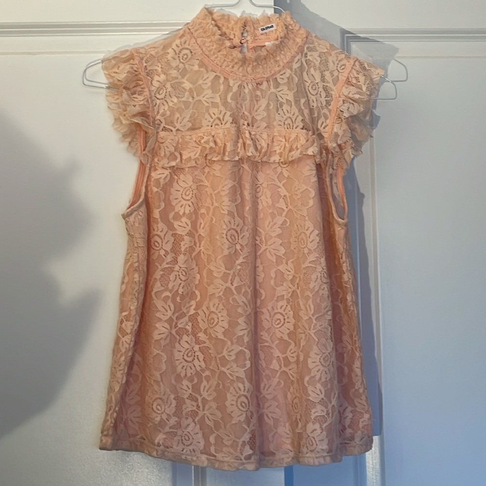 Lacey pink sleeveless top with semi lining and ruffles